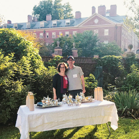 Lowell House faculty deans, Dan and Nina, serving tea out in the Lowell House courtyard.