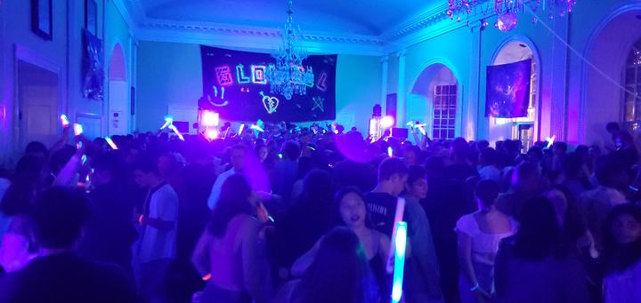 Dining Hall full of Glowell revelers and neon lights