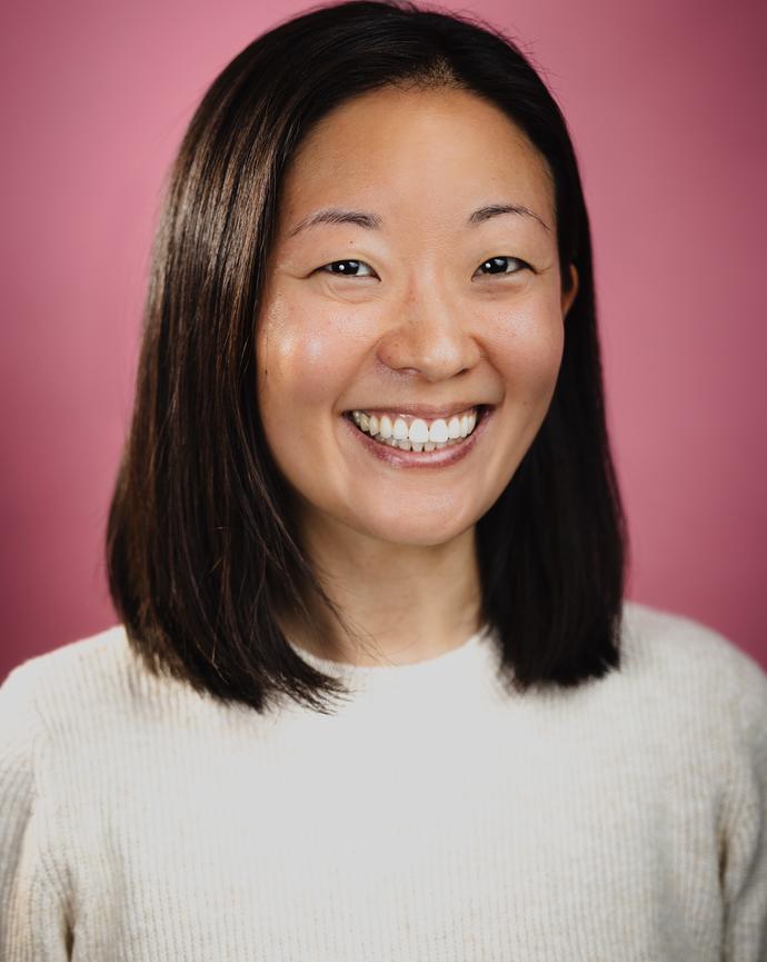 Picture of woman with shoulder length hair, smiling
